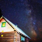 cabin at night with milky way galaxy